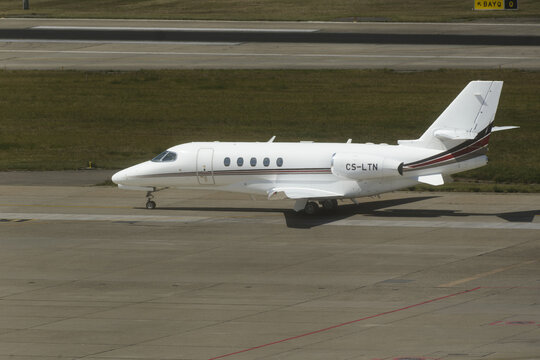 Geneva, Switzerland - August 28, 2026: sign and logo on a Cessna Citation Latitude of NetJets on the tarmac of Geneva airport