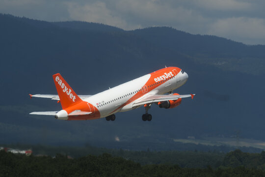 Geneva, Switzerland - August 28, 2026 : sign and logo on Airbus A320-214 of EasyJet take off from Geneva airport