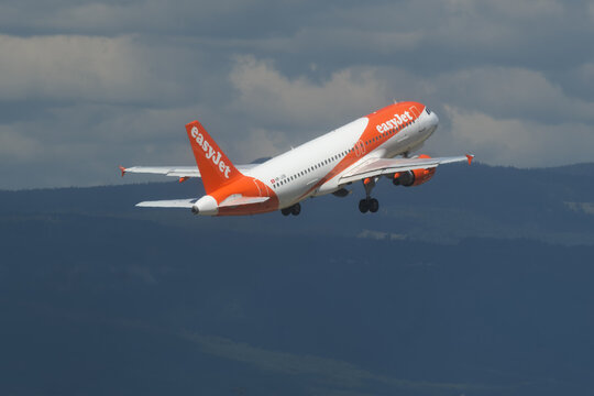 Geneva, Switzerland - August 28, 2026 : sign and logo on Airbus A320-214 of EasyJet take off from Geneva airport