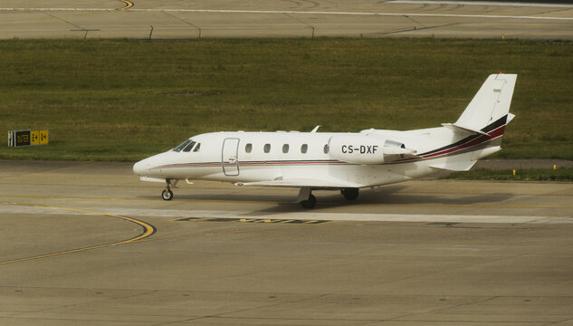 Geneva, Switzerland - August 25, 2025 : sign and logo on a Cessna Citation XLS of Netjets on the runway of Geneva airport