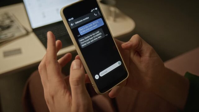 Unrecognizable man holding smartphone, receiving phishing scam message and gesturing in frustration. Clip suitable for cybersecurity awareness and fraud prevention projects