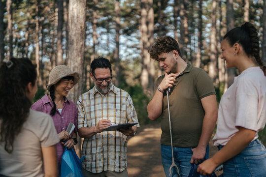Volunteers signing up for forest cleanup project