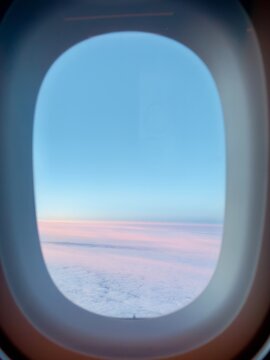  Airplane Window View of Clouds at Sunrise