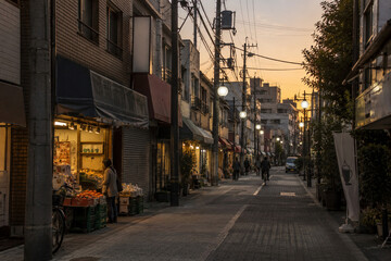 Fototapeta premium Japanese Local Shopping Street at Sunset with Warm Evening Light