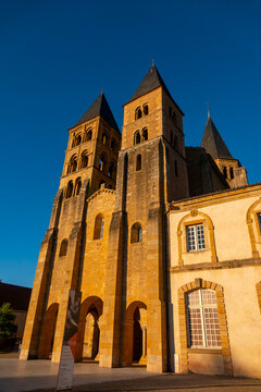 Historic Romanesque Stone Basilica of Paray-le-Monial under Blue Sky.
