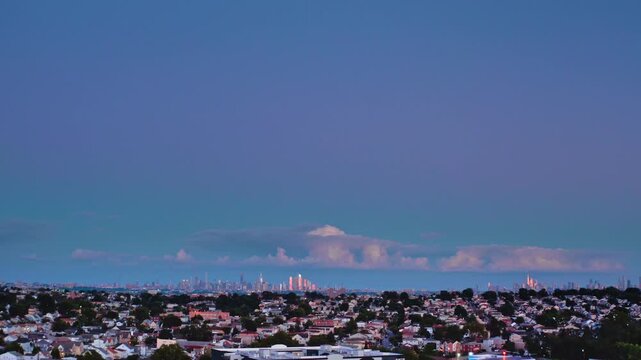 4K Aerial video panorama of Lyndhurst New Jersey suburban neighborhood at twilight with New York City skyline in distance