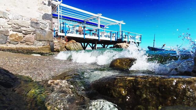 Mediterranean landscape: an Italian village, the sea, and boats.