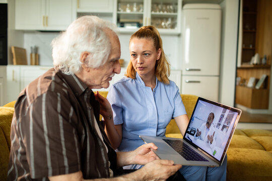 Senior patient with nurse during virtual telemedicine consultation at home