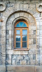 The window of the old mansion 19 century with brown bricks wall © Dmitrii Potashkin