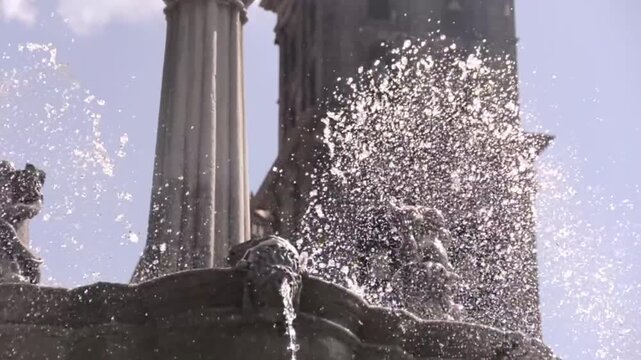 A cinematic close-up explores the carved stonework of Puebla's main Zocalo fountain, emphasizing the intricate details and Baroque character of historic Mexican architecture.