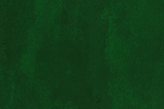 Dark emerald green fabric texture with fine weave and subtle tonal variations, ideal as a textile background for design, fashion and decoration.