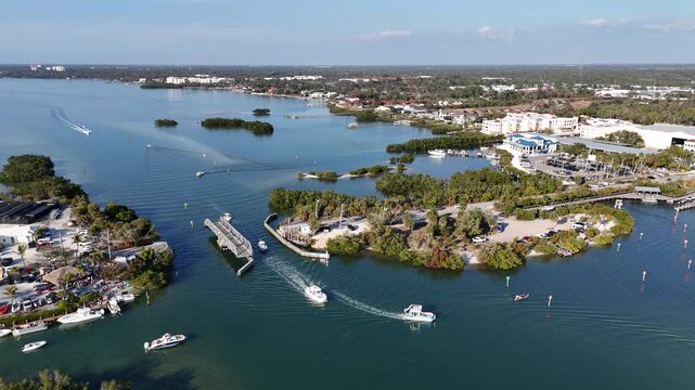 Still shot of boats passing through a historic swing bridge at Blackburn Point near Casey Key in Sarasota, Florida. 