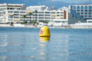 Yellow buoy marking safe swimming zone in antibes © Kristof
