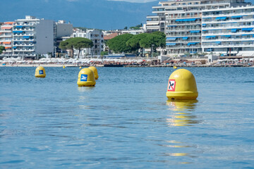 Yellow buoys marking safe swimming zone in antibes bay © Kristof