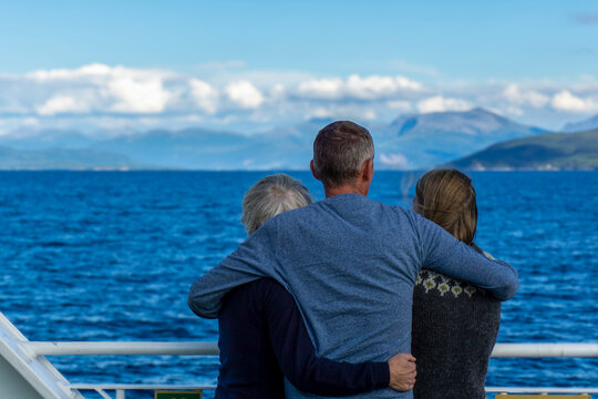 Family enjoying fjord cruise in M&oslash;re og Romsdal, Norway