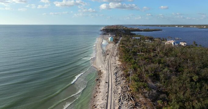 Road erosion caused by hurricane Milton storm surge. Destroyed Manasota Key road at Blind Pass Beach. Severe damage to waterfront infrastructure in Florida