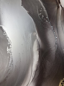 Handmade original alcohol ink abstract macro. Silver metallic fluid texture, swirling patterns, shimmer particles, glossy bubbles. Royalty free artwork, no AI.