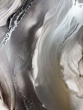 Handmade original alcohol ink abstract macro. Silver metallic fluid texture, swirling patterns, shimmer particles, glossy bubbles. Royalty free artwork, no AI.