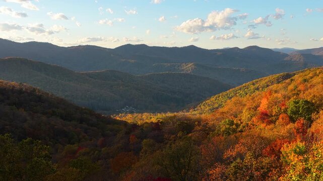 Scenic fall evening landscape of wooded Appalachian mountains. Colorful forest stretches across autumn mountain terrain.