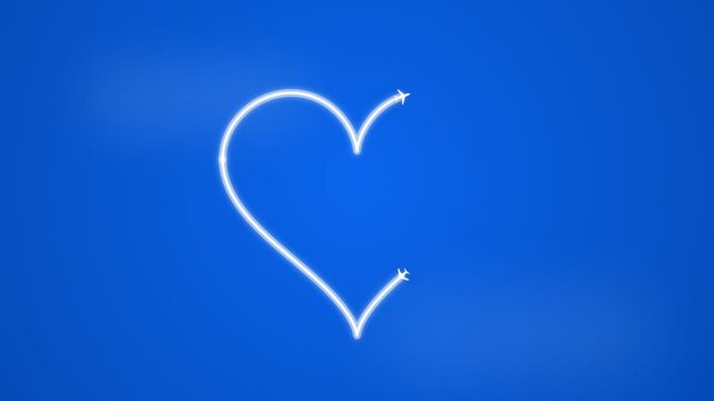 Two airplanes drawing a heart shape with white contrails in a clear blue sky.