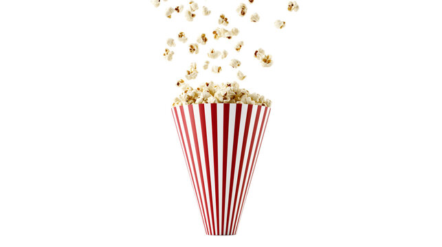 Isolated freshly popped fluffy popcorn falling into a traditional red and white striped movie theater bucket