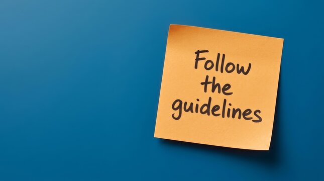 An orange sticker note with the message Follow the guidelines on a blue background.