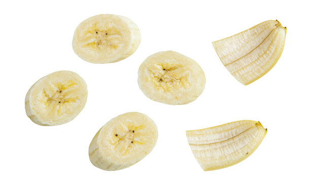 Isolated fresh peeled banana slices and split pieces arranged, healthy tropical fruit snack.