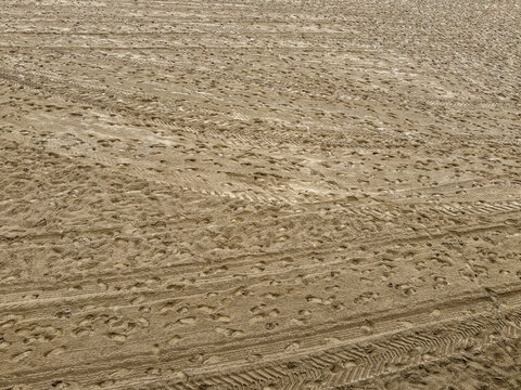 Empty beach chairs lining la concha beach