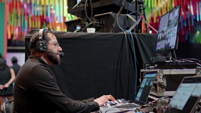Live event production technician managing video switcher
