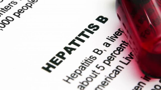 Close up of blood vial on hepatitis b form
