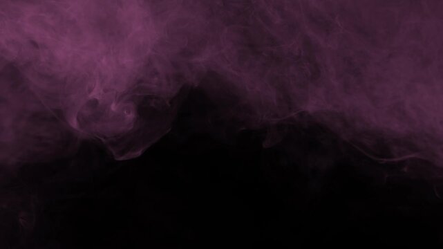 Soft pink fog and smoke drifting slowly on black background