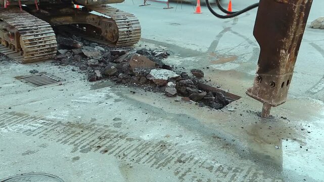 Excavator With Hydraulic Breaker Working On Road Construction
