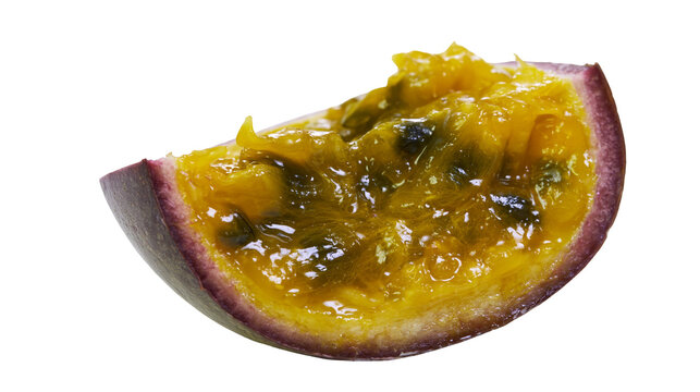 Isolated juicy passion fruit slice with vibrant yellow pulp and seeds, exotic tropical fruit