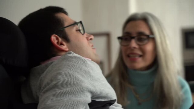 Supportive mother caring for her disabled son