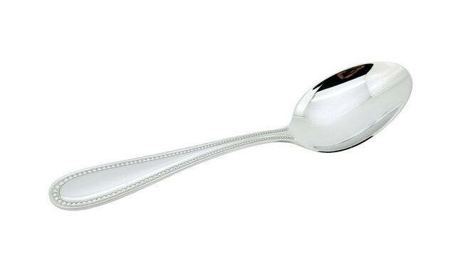 Isolated elegant silver spoon with ornate beaded handle design, shiny polished metal tableware