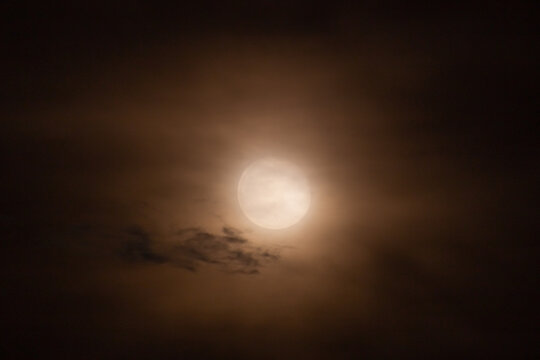  Full moon in the night sky with clouds
