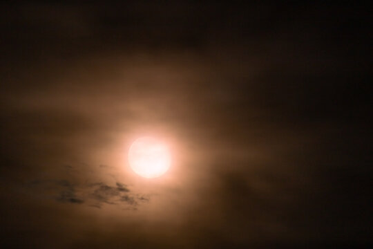  Full moon in the night sky with clouds