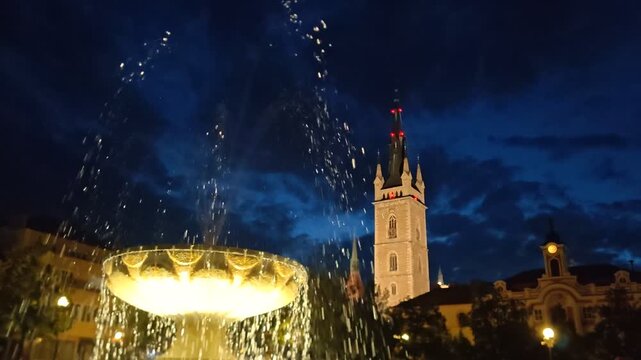 Caslav fountain and town hall tower illuminated at blue hour