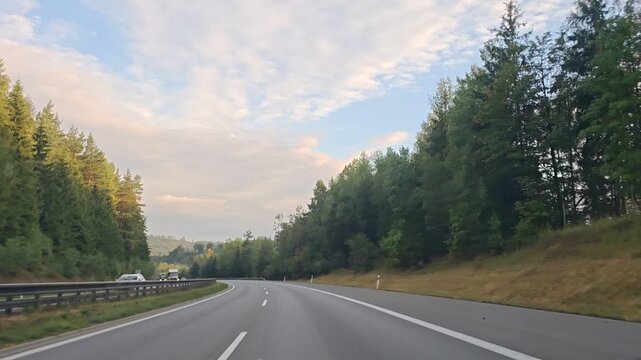 Highway journey from Prague to Plzen through a wooded landscape