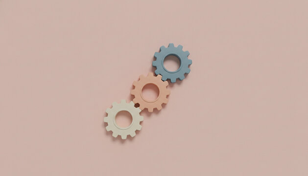 Three pastel gears connected in a diagonal row on a soft pink background symbolizing teamwork and collaboration