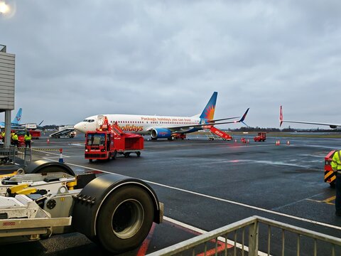 Newcastle upon Tyne,United Kingdom-12 February 2025:JET2 aircraft and ground operations on wet airport apron, commercial aviation