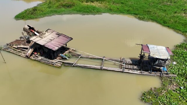 Small wooden vessel used for mining activities on a river in rural South Kalimantan Indonesia