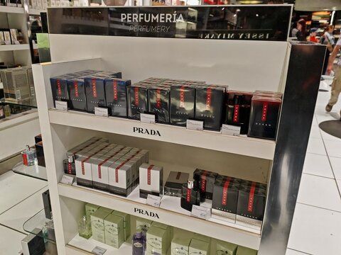 Lanzarote Airport,Spain-12 February 2025:Prada fragrances arranged on a duty free display shelf