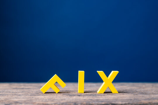 Fixing problems, repair and corrective action concept with fallen F in FIX word