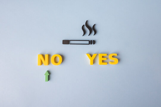 Quit smoking and say no to cigarettes concept with NO choice highlighted by green arrow