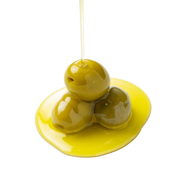 Pouring olive oil on olives placed on a white background