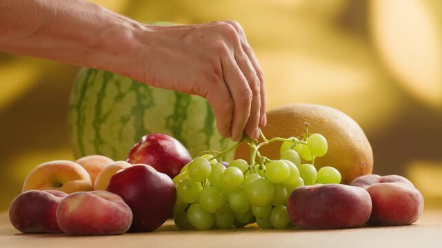 Watermelon, Grape green grapes with peaches and melon, fresh fruit assortment close-up macro shot