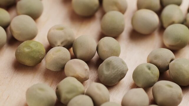 Dry seeds of peas for home vegetable garden etc. Assorted mix of varieties hence variation. Isolated on white background.