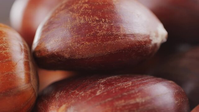 Fresh chestnut, supermarket food, Oven roasted chestnuts with sliced peel on wooden board, spanish traditional winter dish.