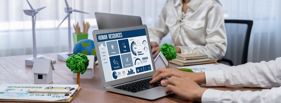 Human resources management software on computer screen helping human resources employee to manage recruitment, payroll, staff searching and KPI evaluation brisk